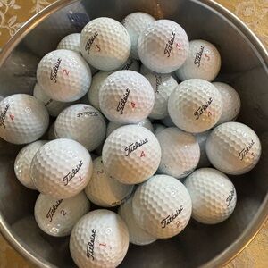 38 Titleist used golf balls in good condition.